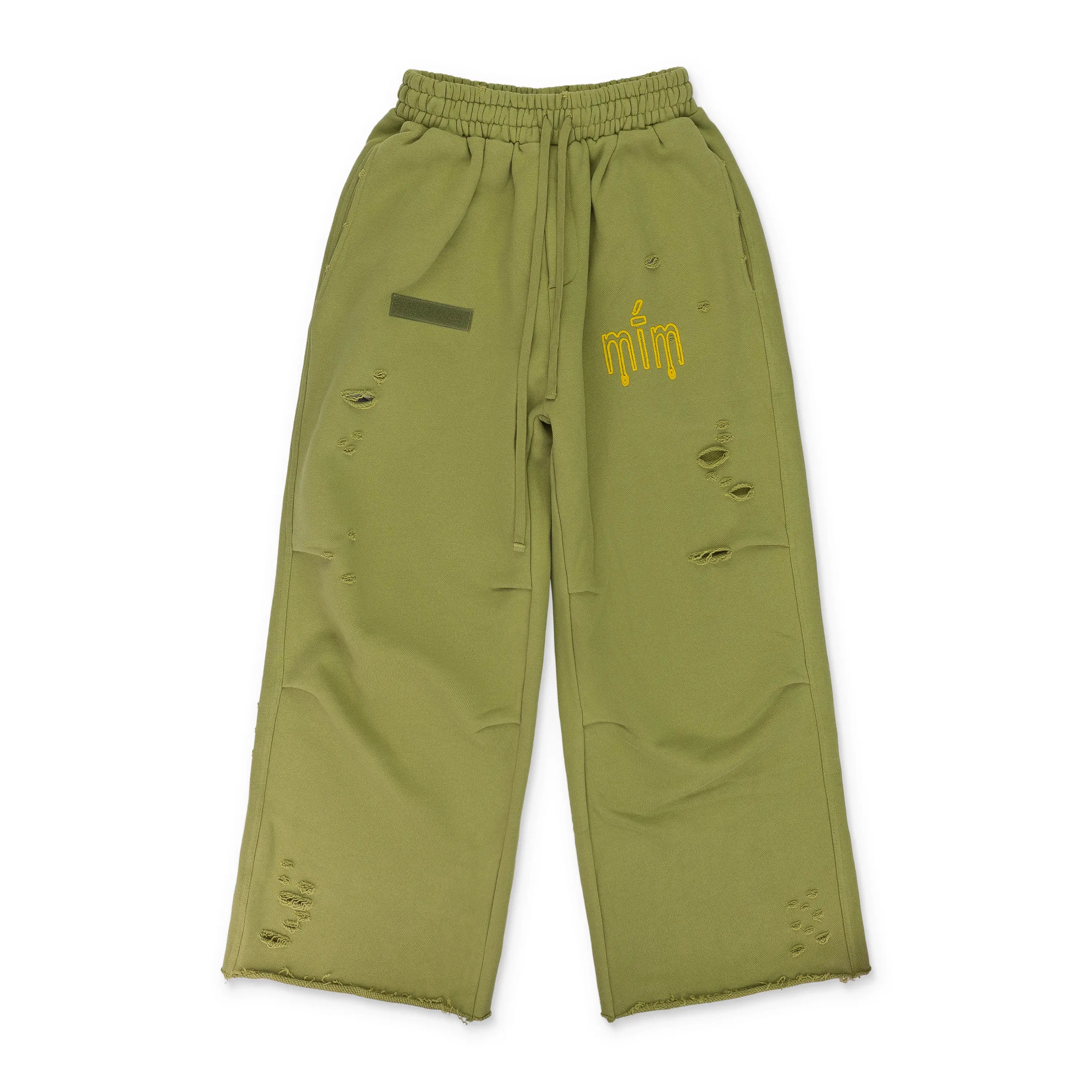 MURD333R.FM General Issue: Special Ops Sweatpants in sage green with a yellow logo.